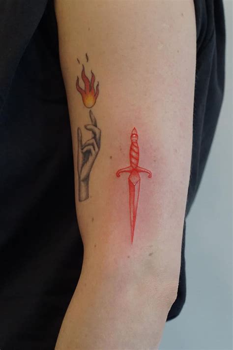A skull or dagger, often omens of death, may turn that rose tattoo from a simple bud of life to an object d&39; memento mori a reminder that life must always end, no matter how beautiful. . Red dagger tattoo
